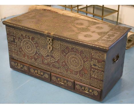 ZANZIBAR TRUNK, 19th century, teak and brass studded, with a hinged top and four drawers, 56cm H x 112cm x 53cm. 