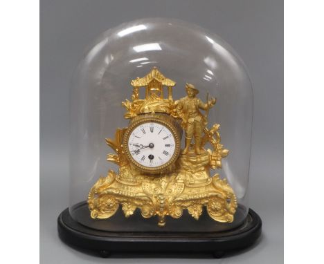 A 19th century gilt mantel clock, under dome