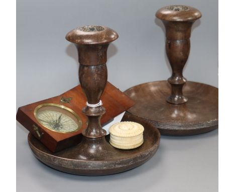 A treen cased compass, a damp detector and a pair of turned wood candlesticks