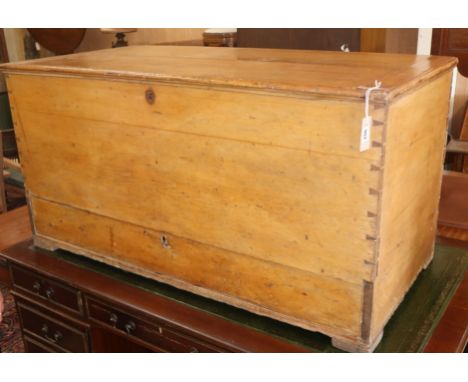 A late Georgian pine trunk with base drawer W.128cm