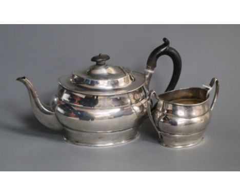 A silver teapot and matching sucrier of oval form, Sheffield 1917, makers Harrison Bros &amp; Howson.