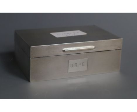 A modern silver engine turned cigarette box, London, 1961, 14cm.