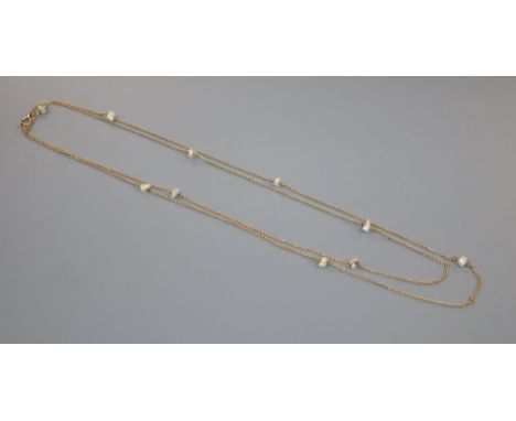 An early 20th century 15ct and baroque pearl set guard chain, 142cm, gross 18.4 grams.