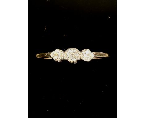 3 Stone diamond ring set with yellow metal Size K