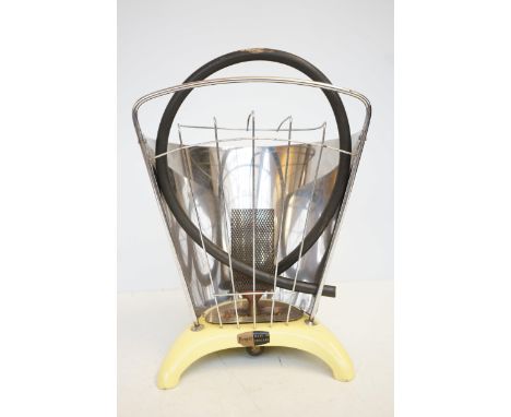 Art deco gas heater by HARPERS, ENGLAND yellowenamelled base and steel back. Unused. Could beadapted to a lamp base?