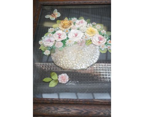 A 1930s-50s unique homemade folk art collagepicture, showing a low relief vase of flowers on a shelf,with a butterfly, made f