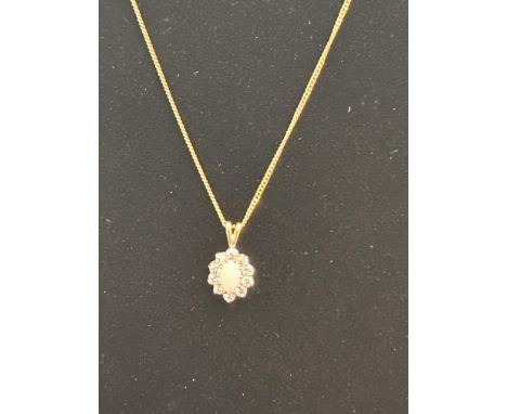 9ct Gold chain & pendant, pendant set with central opal surrounded by 10 white stones 