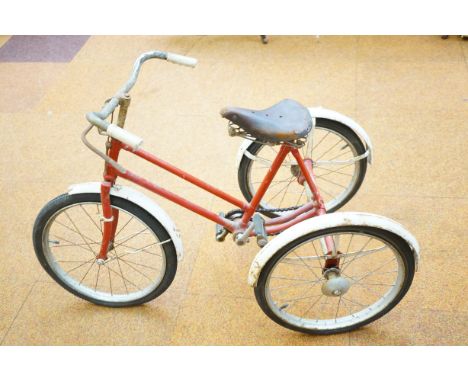 A vintage mid 20th century Lines Bros Ltd, Tri-ang tricycle bike with brooks leather saddle. red and chrome A/F.