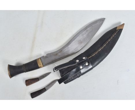 A KUKRI STYLE KNIFE IN ITS ORIGINAL SHEAF, the blade is not decorated and shows some age related wear, it comes with its two 