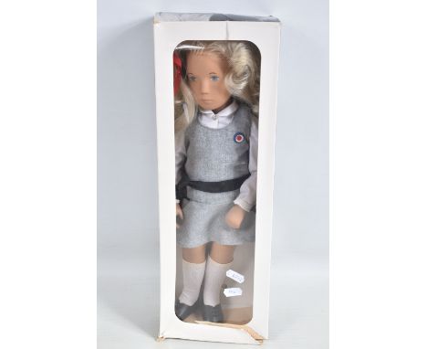 A BOXED TRENDON SASHA DOLL 'Sasha' in School uniform, No.114S, blonde hair, white blouse, grey pinafore dress, appears comple