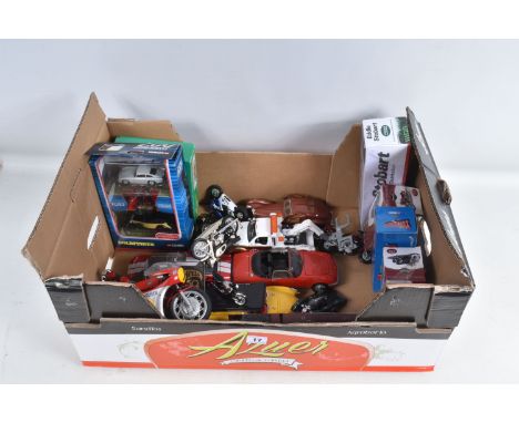 A COLLECTION OF BOXED AND UNBOXED DIECAST AND PLASTIC MODEL VEHICLES, to include motorbikes, cars, trucks, a Hot Wheels Dodge