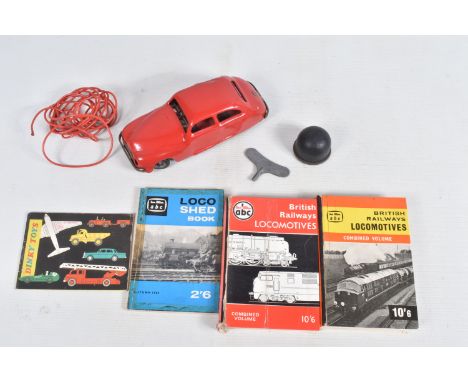 AN UNBOXED CHAD VALLEY TINPLATE CLOCKWORK CAR, red body, black and red interior, with reg. no. CV10046, with key, driving tub