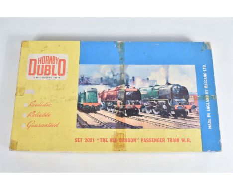 A BOXED HORNBY DUBLO 'THE RED DRAGON' W.R. PASSENGER TRAIN SET, No.2021, comprising Castle class locomotive and tender 'Cardi