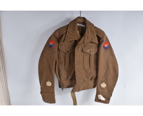 A 1946 PATTERN BRITISH BATTLEDRESS BLOUSE WITH 41st ARMY GROUP RA INSIGNIA, the jacket is size 6 and has the 41st Agra Format