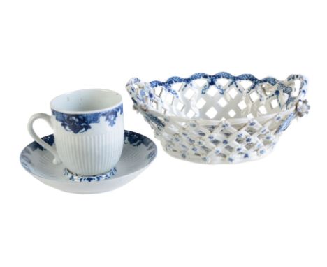 A Worcester blue and white reeded trembleuse coffee cup and saucer in the St. Cloud manner, circa 1758, painted with Beraines