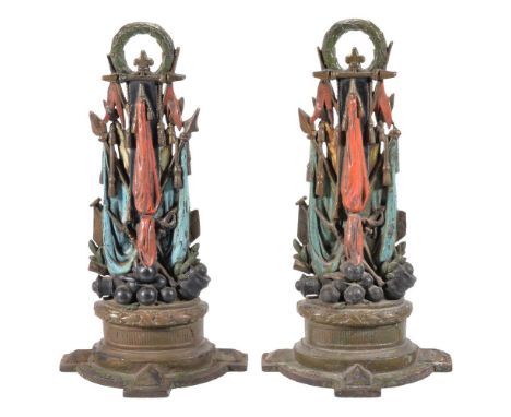 A pair of Victorian painted cast iron door porters modelled as trophies of war, circa 1865, the tops cast with laurel wreaths