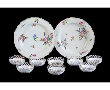 A pair of Worcester porcelain plates, circa 1775, painted with flower sprays, 23cm diameter; and eight Continental enamel ova
