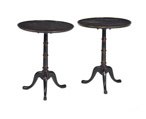 A pair of black and gilt japanned circular tables in George II style, 20th century, each top decorated with river landscapes,