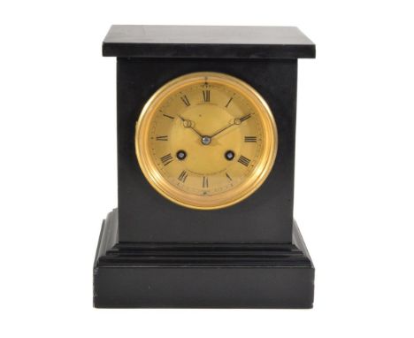 A black slate mantel clock, late 19th century, with French eight-day bell striking movement, the gilt engine turned dial insc