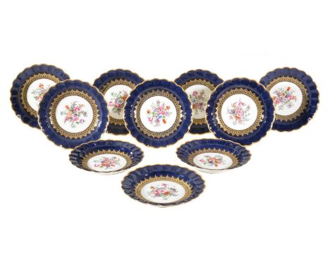 A set of ten Royal Worcester plates, in 18th century style, painted in coloured enamels by E Phillips, within a gilt cartouch