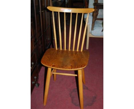 A pair of Ercol type blond elm and beech stickback kitchen chairs
