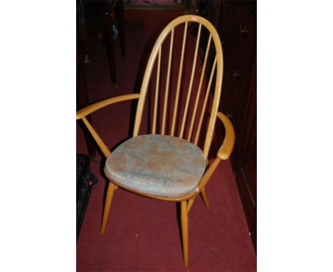 A pair of Ercol light elm stickback open elbow chairs together with a similar side chair (3)