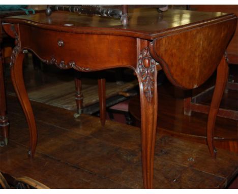 A late 19th century French plum-pudding mahogany sofa table, having single frieze drawer and raised on hipped and leaf carved