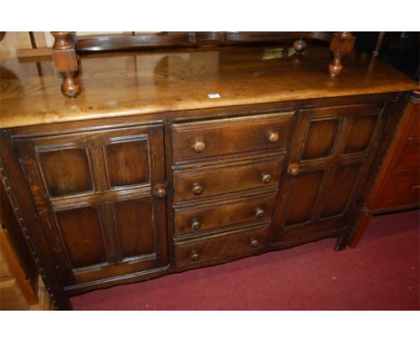 An Ercol mid elm sideboard