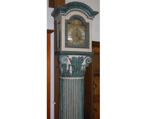 A painted long case clock in the form of a Corinthian column having arched brass dial, signed William Clark of London, with a
