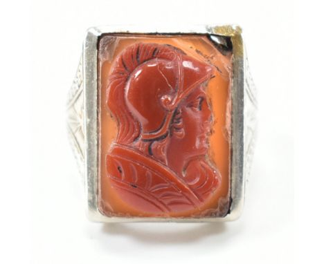 A vintage white gold &amp; carved cameo ring. The ring having a rectangular cut orange &amp; red bezel set stone carved to de