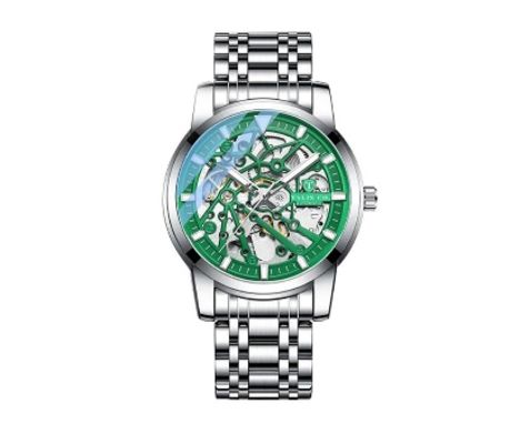 A Talis Co. 7820 automatic stainless steel skeleton dial wrist watch. The watch having a pierced green sunburst bordered skel