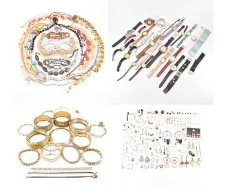 An assorted collection of costume jewellery. The lot to include; necklaces, earrings, wrist watches, bangles, bracelets, gold