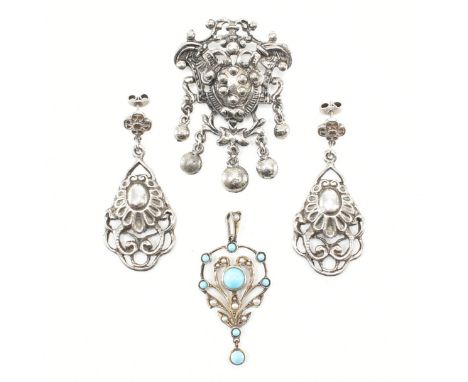 A pair of silver pendant earrings and a gem set white metal pendant and a white metal brooch pin. The earrings marked silver 