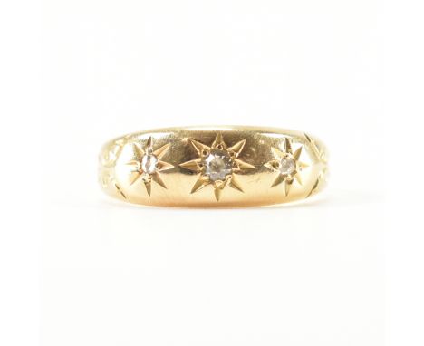 An antique 18ct yellow gold &amp; diamond gypsy dome ring. The ring having three round cut star set diamonds to etched scroll