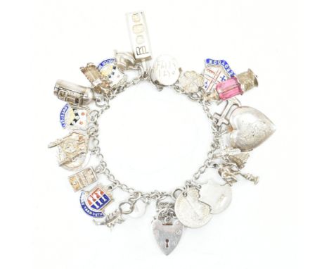 A hallmarked silver heart padlock charm bracelet with charms. The bracelet comprised of curb links united by a heart padlock 