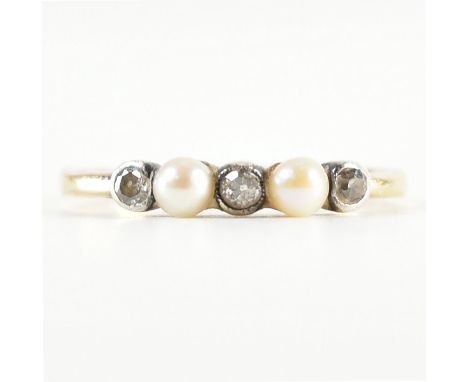 A 1920s gold diamond and pearl five stone ring. The ring set with three old cut diamonds and two pearls to a plain band. Unma