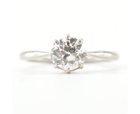 A white gold &amp; diamond solitaire ring. The single stone engagement style ring having a decorative prong set round cut dia