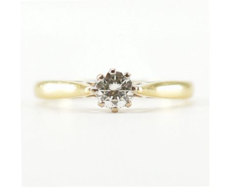 A hallmarked 18ct yellow gold &amp; diamond solitaire ring. The single stone engagement style ring having a round cut diamond