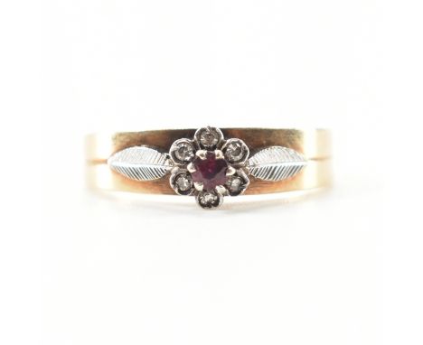 A hallmarked 9ct bicolour gold, spinel &amp; diamond halo ring. The two tone ring having a central round cut prong set dark r