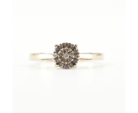 A hallmarked 9ct yellow gold &amp; diamond cluster ring. The ring having a central round cut diamond surrounded by two halos 