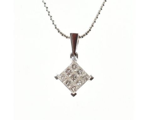 A hallmarked 18ct white gold &amp; diamond pendant with necklace chain. The pendant having a cluster of nine square cut diamo