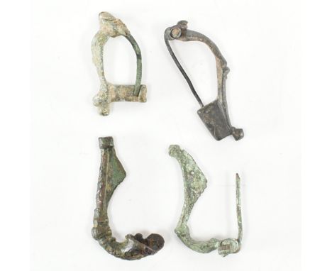 An assorted collection of Roman fibula brooch pin antiquities. The lot to include a 2nd / 3rd century Roman fibula crossbow b