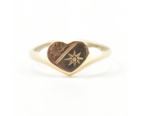 A hallmarked 9ct yellow gold &amp; diamond signet ring. The ring having a heart shaped head with star set accent diamond &amp