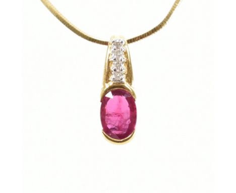 An 18ct yellow gold, ruby &amp; diamond pendant &amp; necklace chain. The pendant having an oval cut ruby half bezel set bene