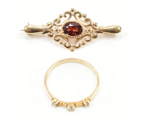 A hallmarked 9ct gold diamond ring and brooch pin. The ring set with three round brilliant cut diamonds to a plain band, hall