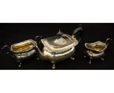 A three piece Victorian silver bachelors tea set comprising teapot, twin handled sucrier and milk jug, all of rectangular bel