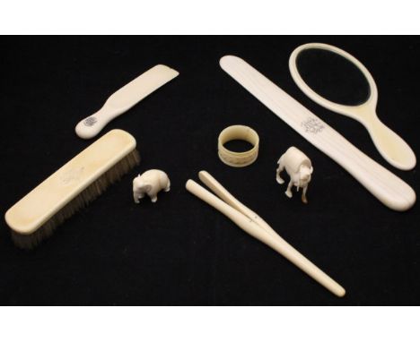 A collection of various late 19th Century ivory dressing table items comprising hand mirror, shoe horn, page turner, glove st