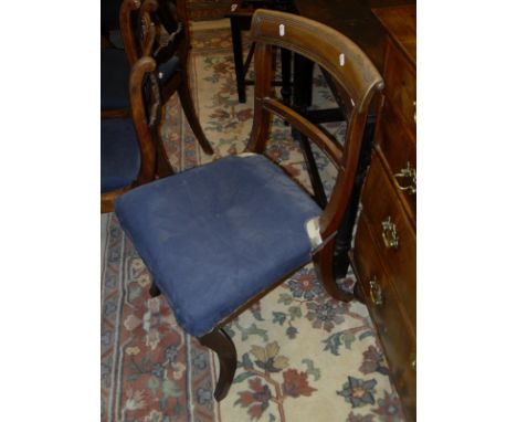 A set of six Victorian mahogany bar back dining chairs raised on sabre legs, together with a pair of similar  carver bar back