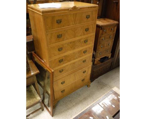 A mid 20th Century walnut chest of seven long drawers on cabriole legs to pad feet and a modern yew wood veneered miniature b