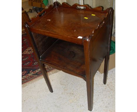 An Edwardian mahogany bedside cabinet, the top as a tray top above an open shelf raised on square legs together with a mahoga